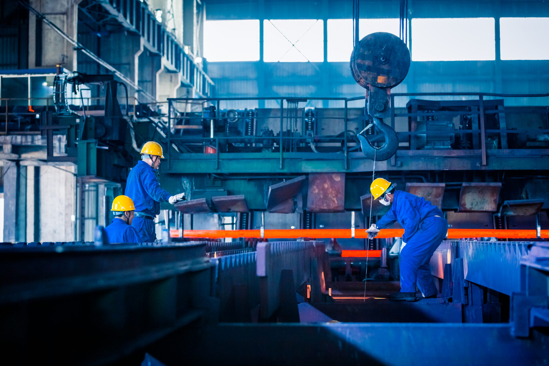 Workers inside the steel factory